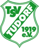 TSV Tudorf Logo mit einem grünen Schild, das die Aufschrift 'TUDORF' diagonal in der Mitte trägt, zusammen mit den Initialen 'TSV' und dem Gründungsjahr '1919 e.V.'